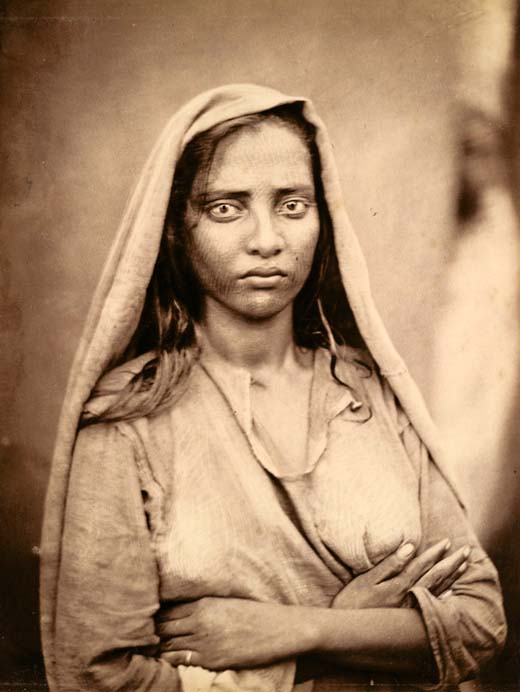 Woman, standing with folded arms – 1860’s
